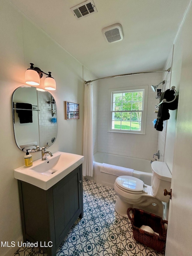 308 College St, Carthage, MS 39051 - bathroom with vanity, shower / bath combo, toilet, and visible vents