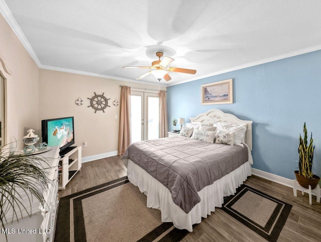 bedroom featuring wood-type flooring, ornamental molding, ceiling fan, and french doors