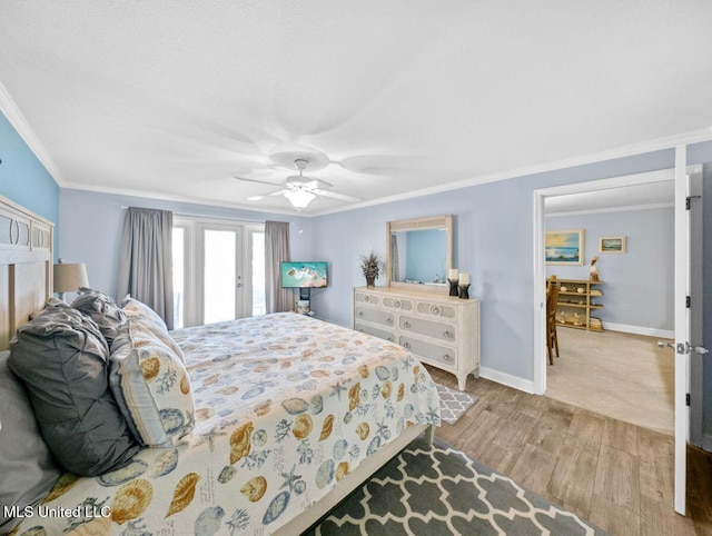 bedroom featuring ornamental molding, ceiling fan, and light hardwood / wood-style floors