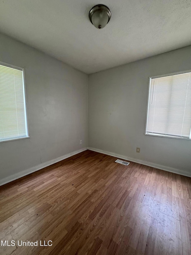 941 Dorgan St, Jackson, MS 39204 - unfurnished room with wood finished floors and baseboards