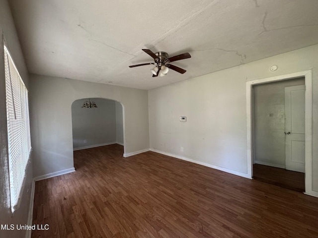 941 Dorgan St, Jackson, MS 39204 - spare room featuring arched walkways, a ceiling fan, and wood finished floors