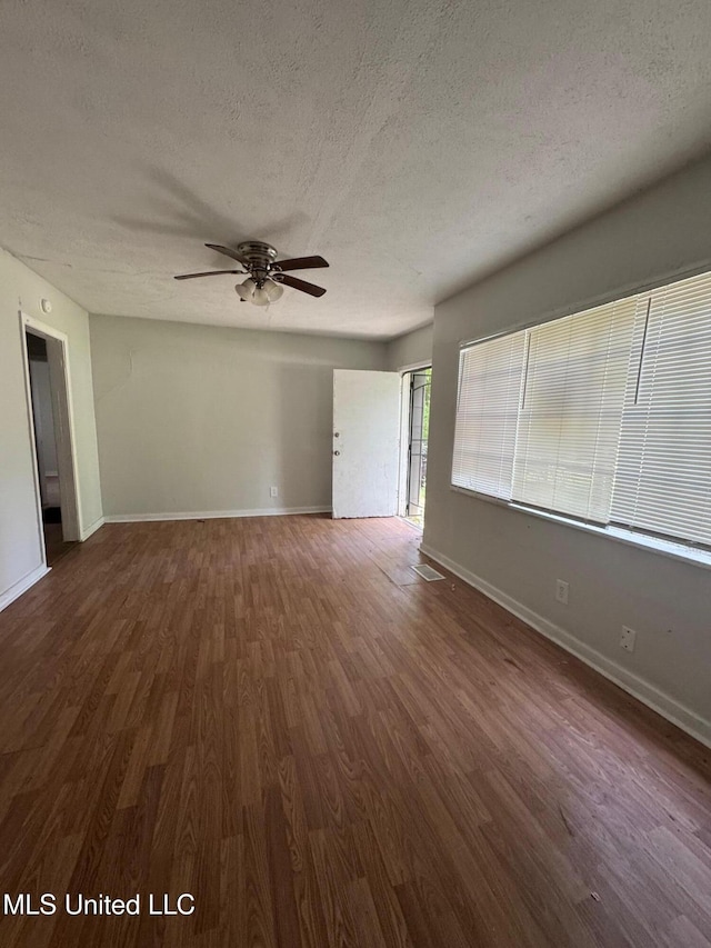 941 Dorgan St, Jackson, MS 39204 - unfurnished room featuring a textured ceiling, a ceiling fan, and wood finished floors