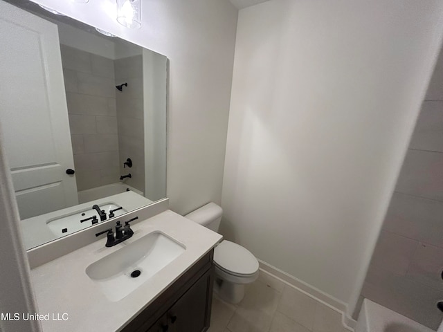 full bathroom with tile patterned flooring, vanity, toilet, and tiled shower / bath