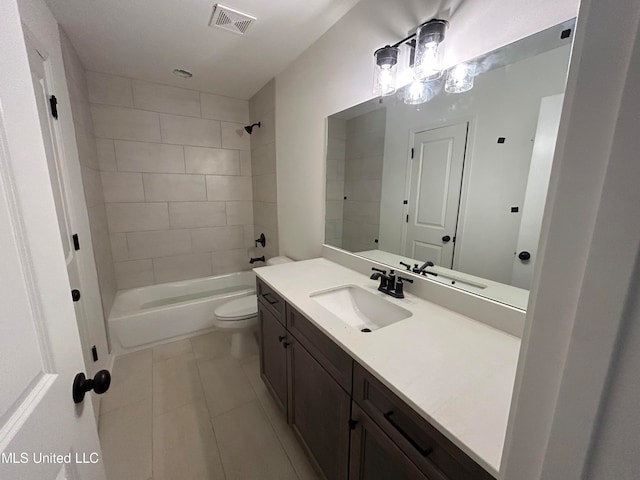 full bathroom with tile patterned flooring, vanity, toilet, and tiled shower / bath combo