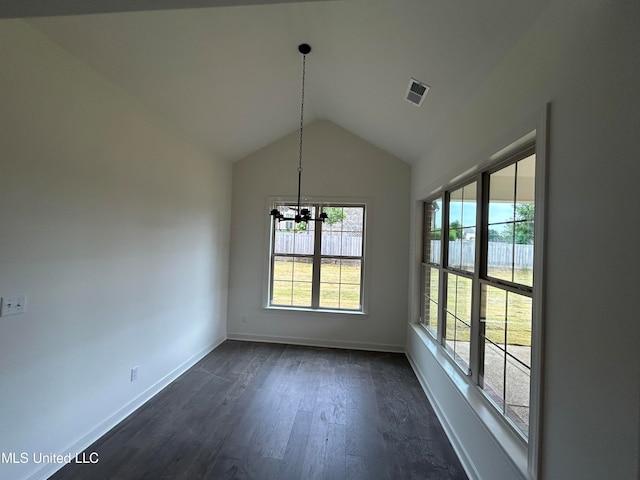 unfurnished dining area featuring a chandelier, dark hardwood / wood-style flooring, and lofted ceiling