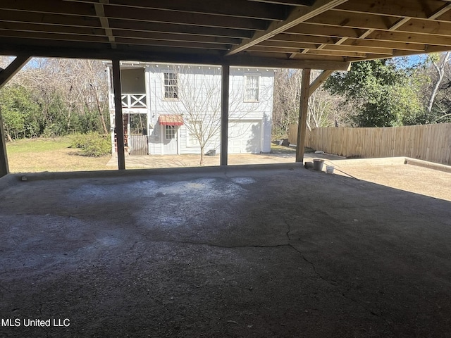 view of patio featuring fence