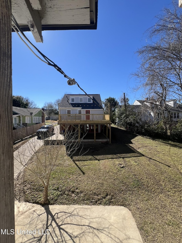 view of yard featuring a residential view and fence