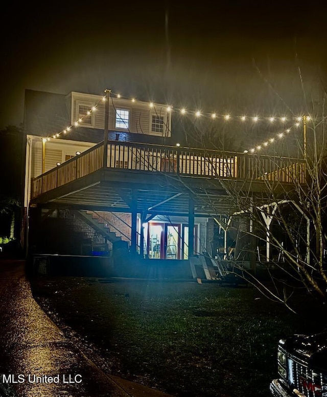 view of back of house at night