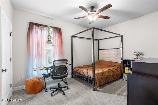 bedroom featuring carpet floors, baseboards, a desk, and ceiling fan