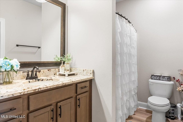 full bathroom with toilet, vanity, wood finished floors, and a shower with curtain