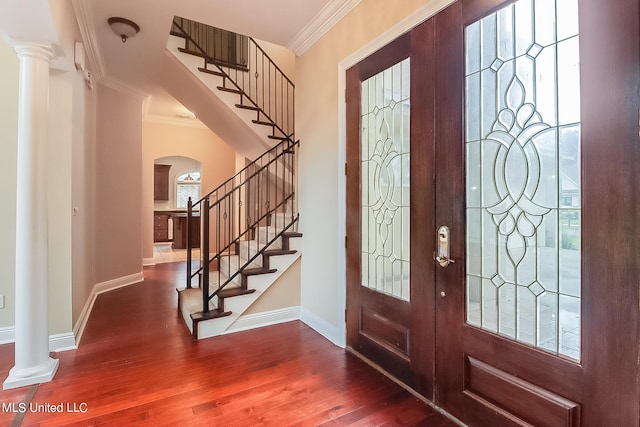 entryway with french doors, ornamental molding, decorative columns, and dark hardwood / wood-style floors