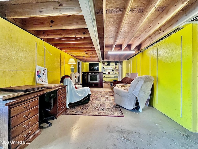 living area with concrete flooring