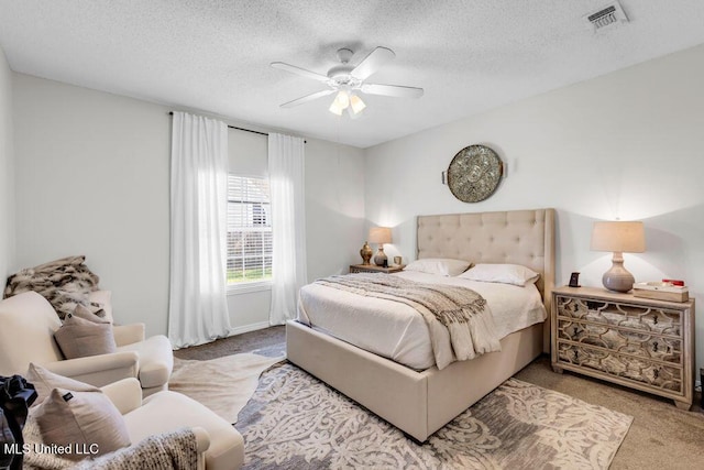 10840 Ala Moana St, Diamondhead, MS 39525 - carpeted bedroom featuring a textured ceiling and ceiling fan