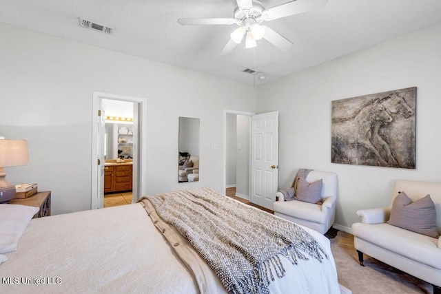 10840 Ala Moana St, Diamondhead, MS 39525 - bedroom featuring ensuite bath, a ceiling fan, and baseboards