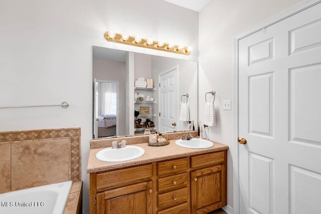 10840 Ala Moana St, Diamondhead, MS 39525 - ensuite bathroom with tiled tub and double vanity