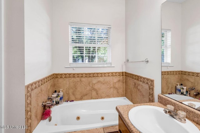10840 Ala Moana St, Diamondhead, MS 39525 - bathroom with a sink, healthy amount of natural light, and a jetted tub