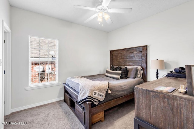10840 Ala Moana St, Diamondhead, MS 39525 - carpeted bedroom with baseboards and a ceiling fan
