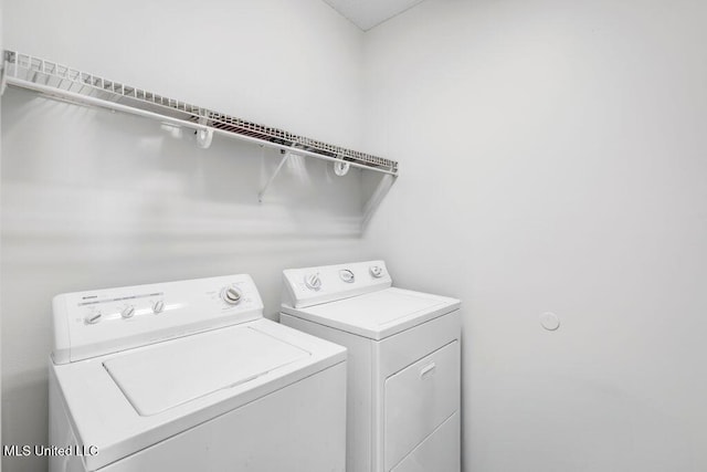 10840 Ala Moana St, Diamondhead, MS 39525 - clothes washing area with washing machine and clothes dryer