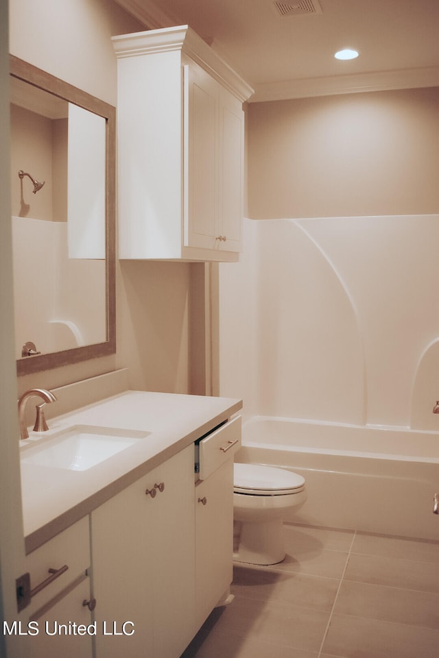 full bathroom featuring vanity, shower / washtub combination, toilet, and tile patterned flooring