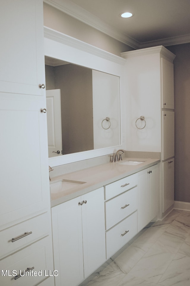 bathroom featuring vanity and crown molding