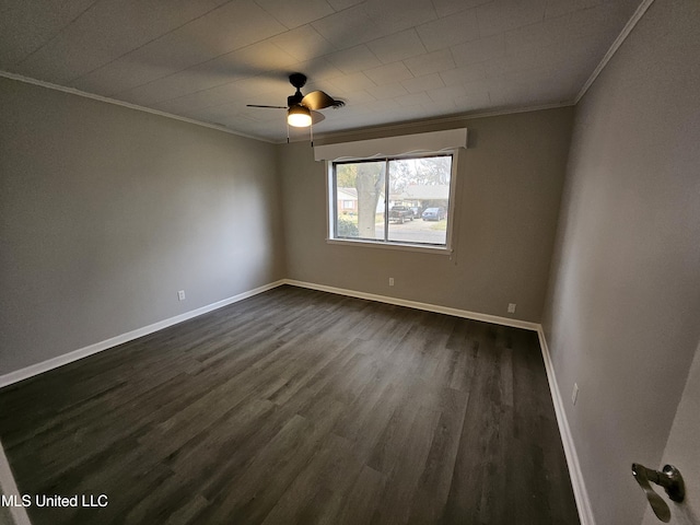unfurnished room featuring crown molding, baseboards, ceiling fan, and dark wood-type flooring