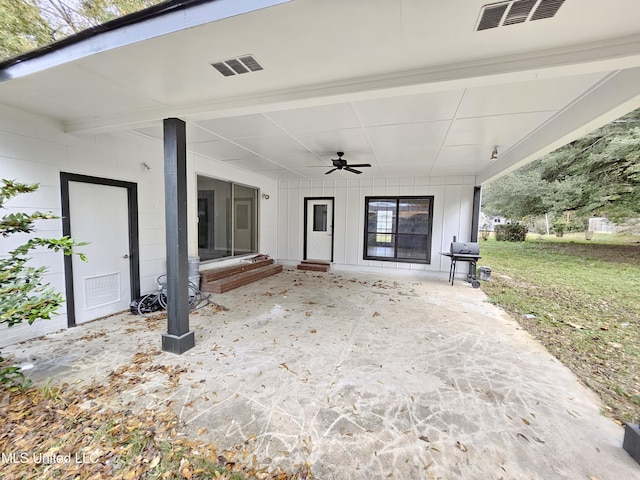 view of patio / terrace featuring a ceiling fan and visible vents