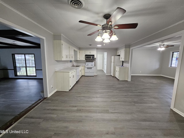 kitchen with ceiling fan, a sink, white appliances, open floor plan, and visible vents