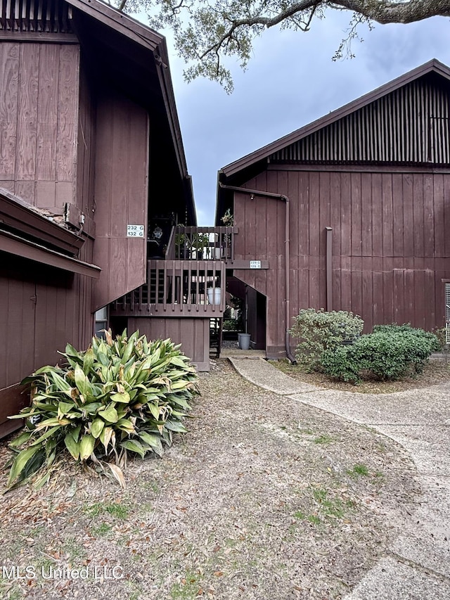 view of home's exterior with an outdoor structure