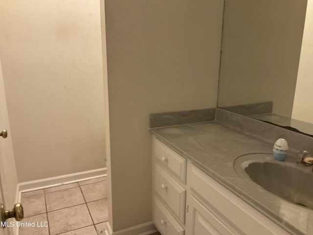 bathroom featuring tile patterned flooring and vanity