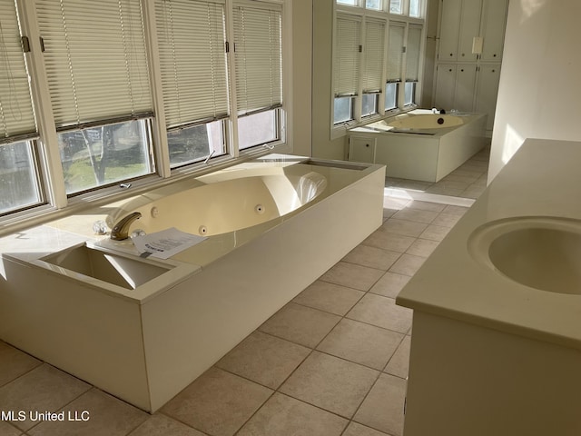 bathroom featuring tile patterned floors, plenty of natural light, and vanity