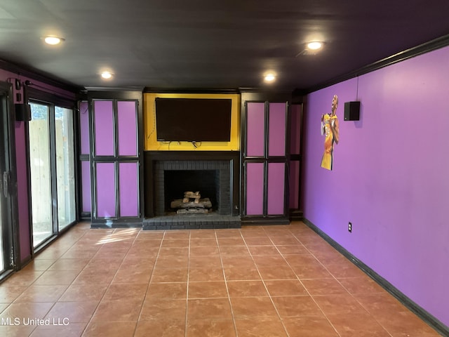 unfurnished living room featuring a fireplace, tile patterned floors, plenty of natural light, and crown molding