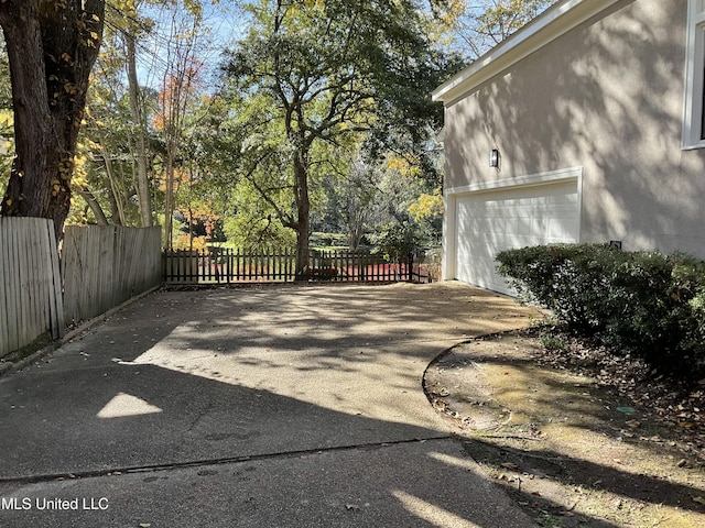 view of patio featuring a garage