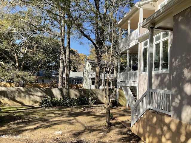 view of yard featuring a balcony