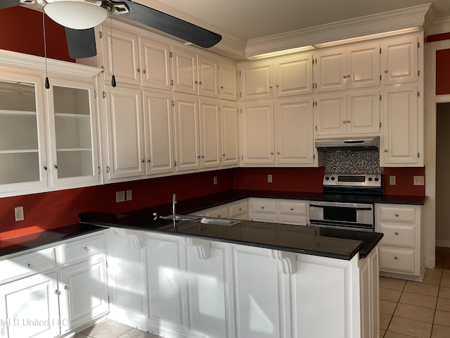 kitchen featuring sink, electric range, ornamental molding, light tile patterned flooring, and white cabinetry