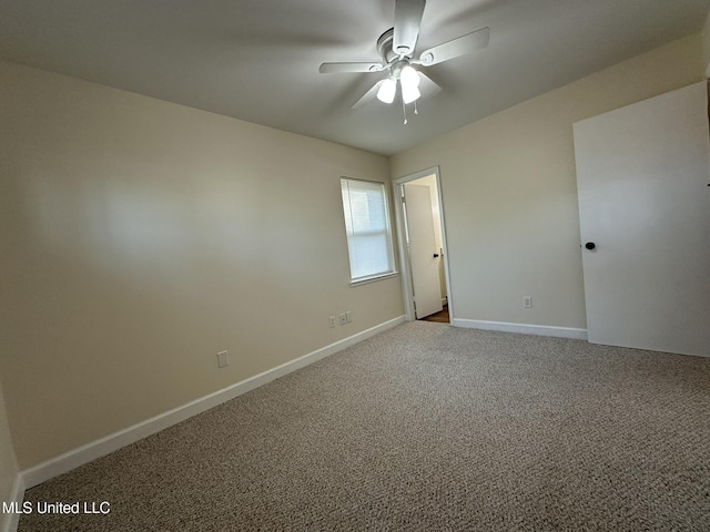 carpeted empty room with ceiling fan