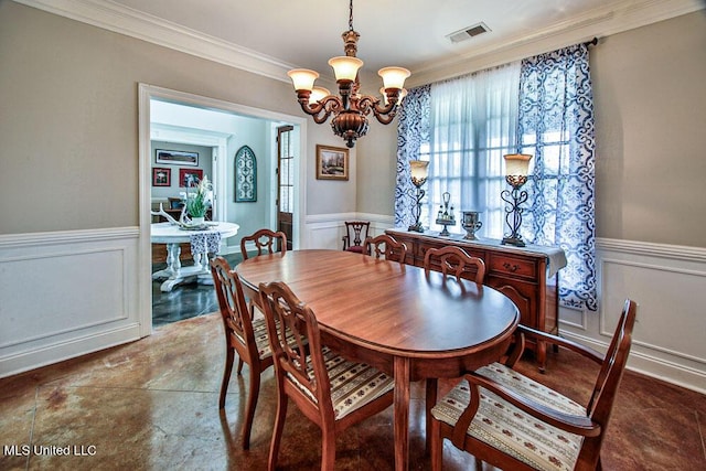 2948 Grove Meadows Dr, Nesbit, MS 38651 - dining room with a chandelier, wainscoting, ornamental molding, and a decorative wall