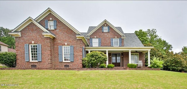 2948 Grove Meadows Dr, Nesbit, MS 38651 - traditional home with a front yard, brick siding, and covered porch