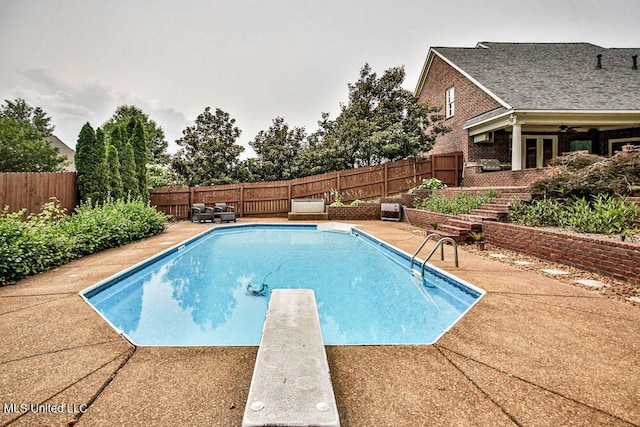 2948 Grove Meadows Dr, Nesbit, MS 38651 - view of swimming pool with a fenced backyard, a diving board, and a patio