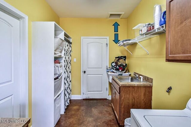 2948 Grove Meadows Dr, Nesbit, MS 38651 - laundry room featuring washer / dryer, cabinet space, and baseboards