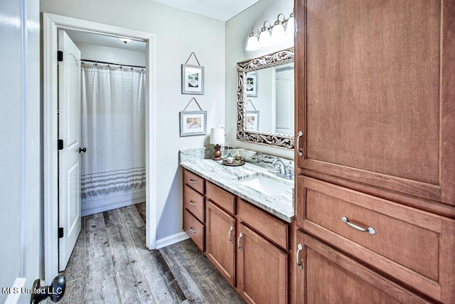 2948 Grove Meadows Dr, Nesbit, MS 38651 - bathroom with wood finished floors, vanity, baseboards, and a shower with curtain