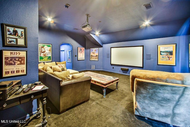 2948 Grove Meadows Dr, Nesbit, MS 38651 - carpeted home theater room with lofted ceiling and a textured wall