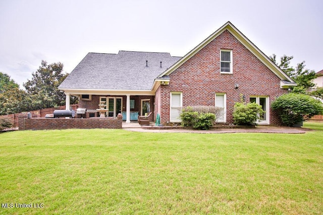 2948 Grove Meadows Dr, Nesbit, MS 38651 - rear view of property featuring brick siding, a patio, and a yard