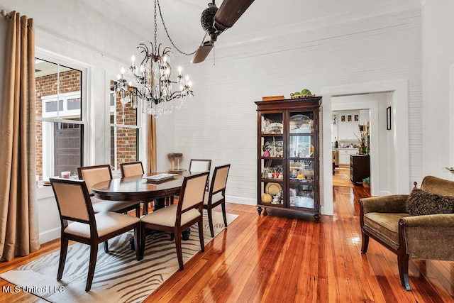 dining area featuring a notable chandelier and wood-type flooring