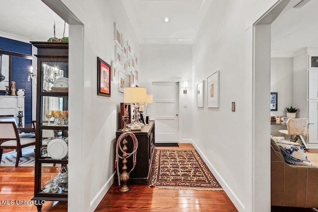 hall with wood-type flooring