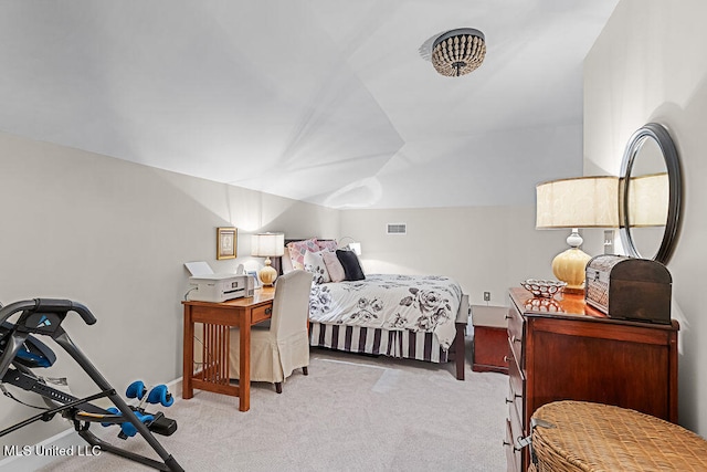 bedroom with light colored carpet and vaulted ceiling