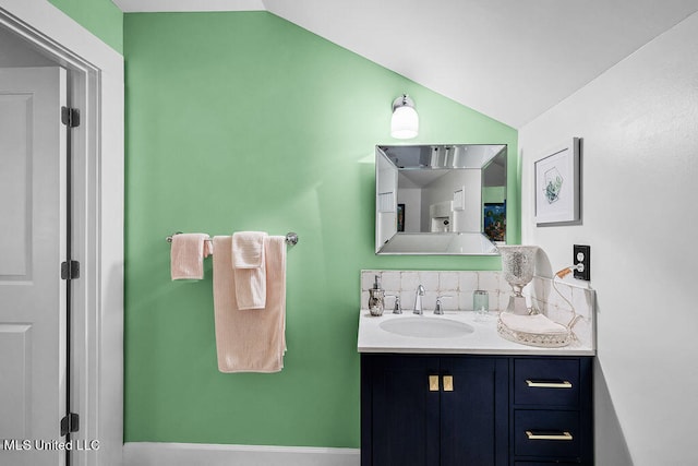 bathroom with vanity and vaulted ceiling