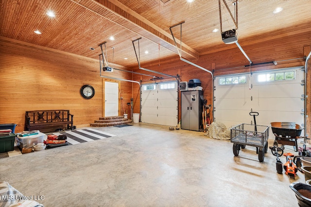 garage featuring a garage door opener, wooden ceiling, and wood walls