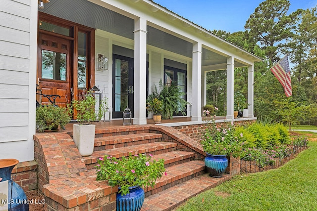 doorway to property featuring covered porch