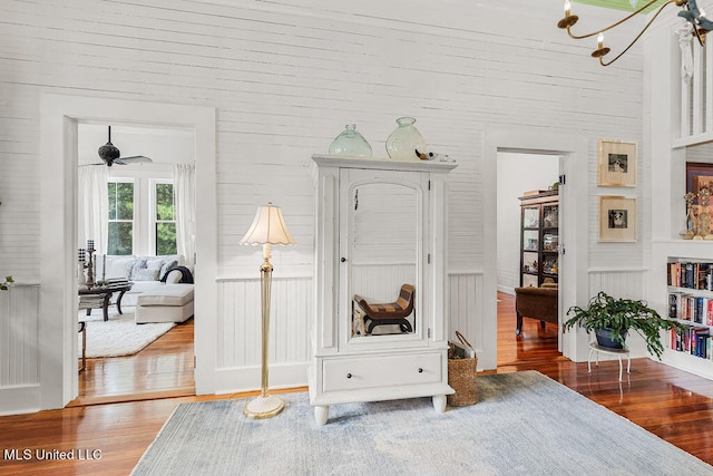 sitting room with hardwood / wood-style floors, wood ceiling, and ceiling fan