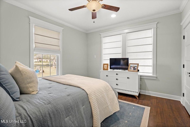 bedroom featuring ceiling fan, crown molding, baseboards, and wood finished floors